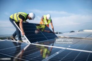 Two Men Installing Solar Panel